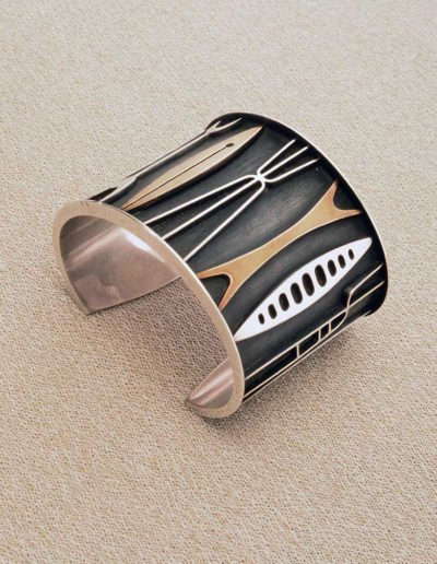bracelet cuff: silver with appliqued shapes